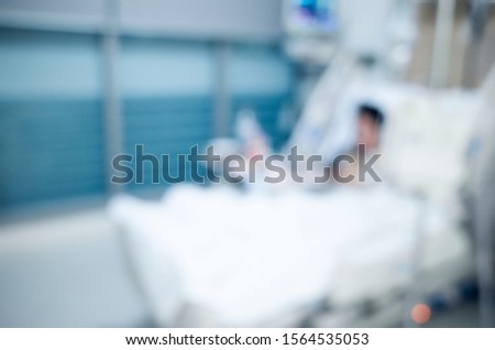 blur background of patient lying on bed in hospital ICU ward, medical and healthcare concept