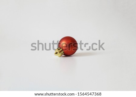 Red christmas ball on the table