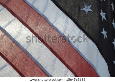 American flag backlit by sun abstract close up