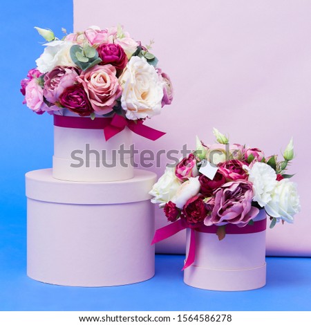 Beautiful colorful flowers in pink box