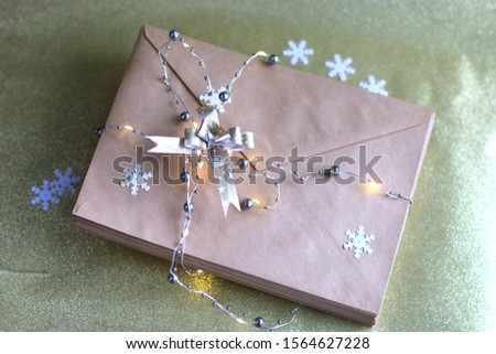 Envelopes for letters. Artificial snowflakes, bow for decoration, garland