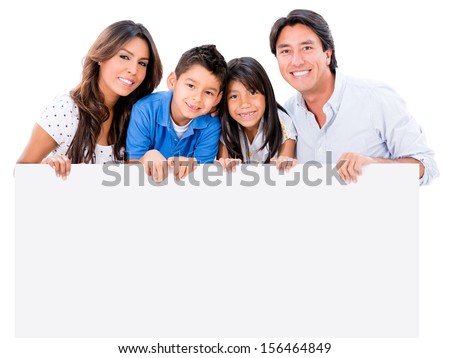Happy family holding a placard  and smiling - isolated over white 