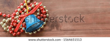 Christmas and Happy New Year Holiday Season and Cover Concept. Top view of  blue bell xmas ornament and accessories and on old wooden plank with copy space.
