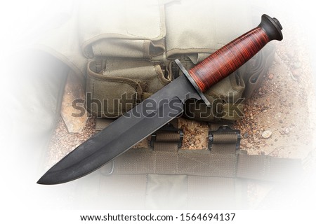 large army knife with a leather handle