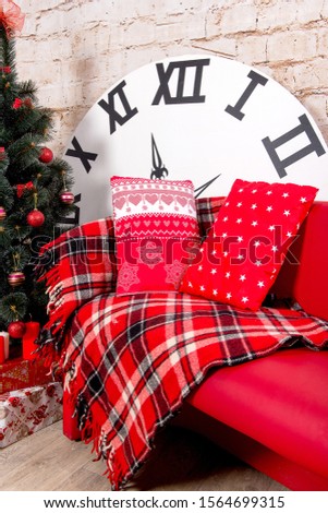 New Year's interior room. Christmas tree decorated with colorful balloons and gifts lie on the floor. Christmas and New Year background.