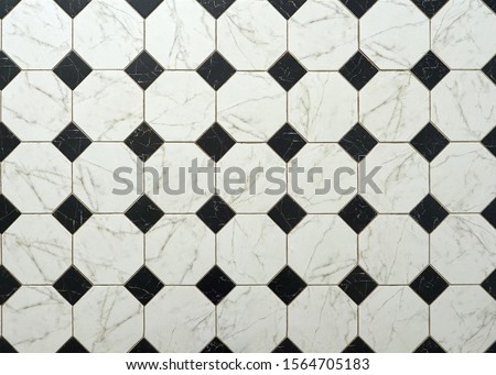 Close up surface of black and white square tiles