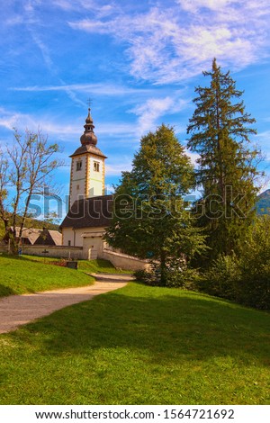 Beautiful landscape photo of Ancient John the Baptist Church near Bohinj lake. Popular travel destination in Slovenia. Triglav National Park, Slovenia .