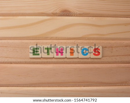 Word Ethics on wood background
