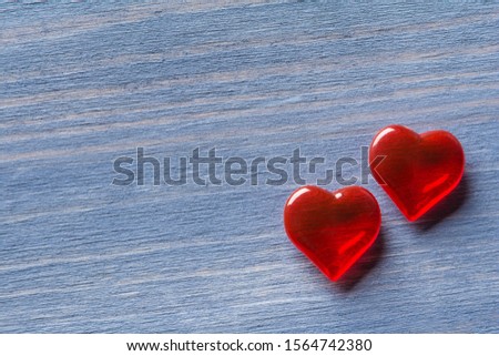 Two red hearts on a blue vintage background 