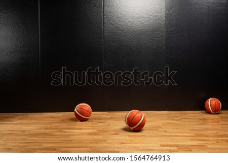 
Basketball ball over floor in the gym