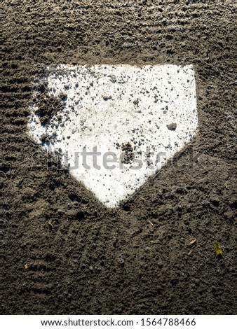 Baseball home plate with dirt on it