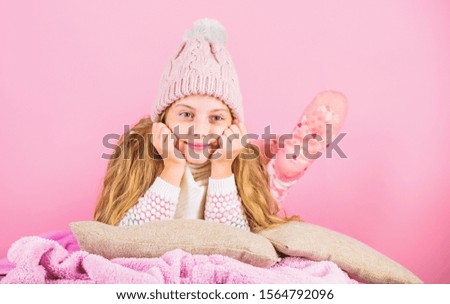 Kid girl knitted hat and scarf. Winter accessory concept. Girl long hair dream pink background. Winter season concept. Kid dreamy wear knitted hat. Winter rest and relax. Winter fashion accessory.