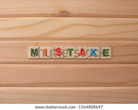 Word Mistake on wood background