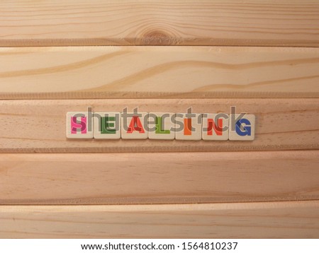 Word Healing on wood background