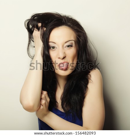 portrait picture of teenage girl sticking out her tongue