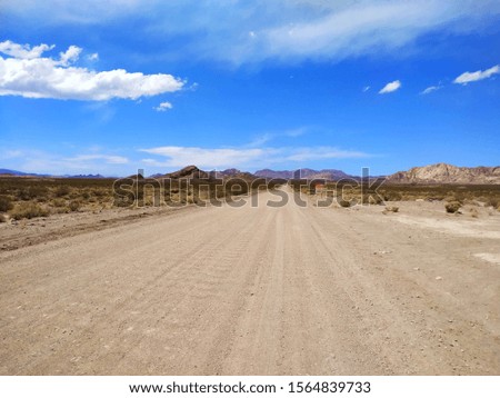 Dusty road in the Andes mountains, Mendoza Province, Argentina
