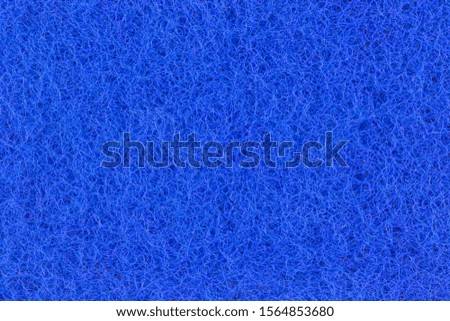 Abstract texture of the blue surface washcloths for washing dishes macro close-up background.