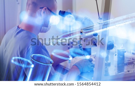 Scientist man with test tubes in lab