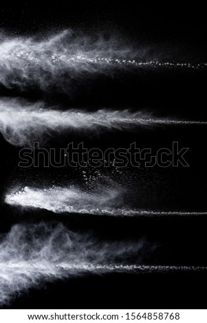 trail from a jet engine on a black background, spraying particles under high pressure Royalty-Free Stock Photo #1564858768