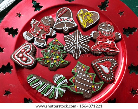 Colorful christmas gingerbread cookies on plate