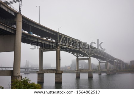 Marquam Bridge over Willamette River in Portland on a misty fall morning.