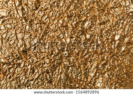 Crumpled Gold Foil. Background image and texture. copy space