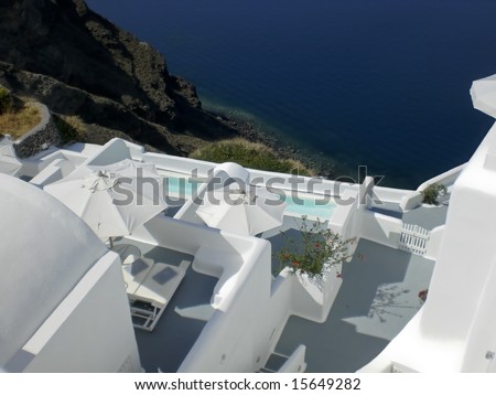 The stunning village of Oia hanging from the cliffs in the volcanic island of Santorini, Greece