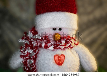 Christmas Snowman puppet with red hat and scarf. 