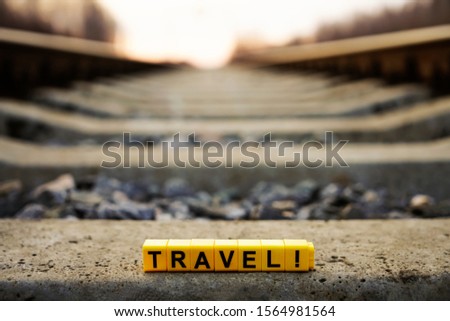 word travel . Railway with sun rays background