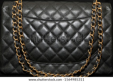 Photo of black classic handbag closeup - Image