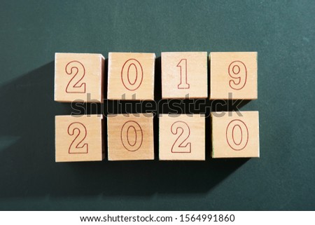 wooden block with number 2020 happy new year               