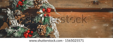 Advent Christmas wreath on wooden door decoration. Lettering Merry Christmas Minimal winter vacation idea.