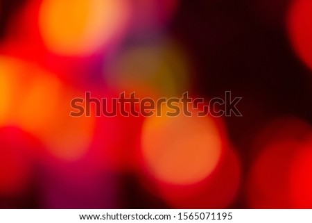 Christmas holiday red lights bokeh background. New Year blurry walpaper.