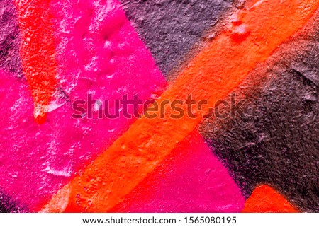 Beautiful bright colorful street art graffiti background. Abstract creative drawing fashion colors on the walls of the city. Urban  Culture, black , yellow, red , green, blue, orange texture