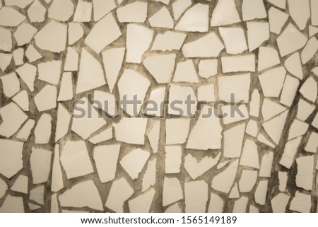 Broken tiles mosaic seamless pattern. Cream tile real wall high resolution real photo or brick seamless with texture interior background. Abstract wallpaper irregular in bathroom.
