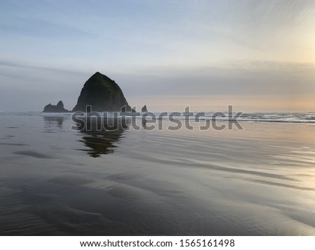 Picture of the Haystack Rock at Cannon Beach in Oregon. Taken during sunset with no people in the shot.