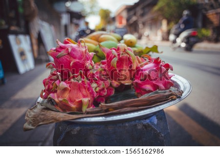 drageon fruit and other fruits on a plate at the streets in bali indonesia