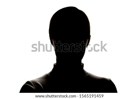Dark silhouette of a young girl on a white background, front view, the concept of anonymity Royalty-Free Stock Photo #1565191459