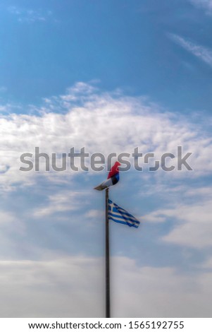 Bird Weathervane. Rooster wind vane silhouette with cloudy sky in the background. Stock Image.