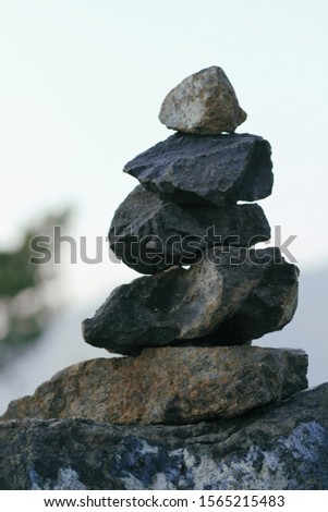 Zen pyramid of spa stones on the blurred background. Place for text.	
Mountain landscape. Calm place. Balance concept.
