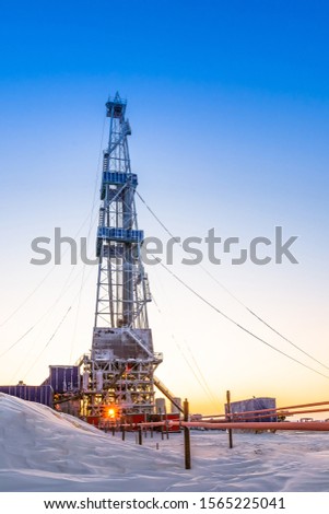 Winter polar day in the arctic. Drilling a well at a northern oil and gas field. Low sun. Beautiful lighting.