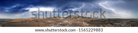 Aerial panoramic view of Cody landscape and Stampede Rodeo Park with storm approaching, Wyoming.
