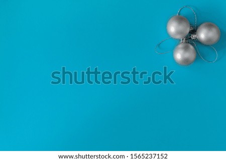 Christmas gray balls on a blue background flat lay minimalistic background New Year