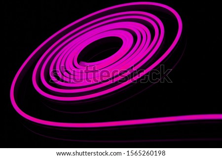 Purple flexible led tape neon flex on black background