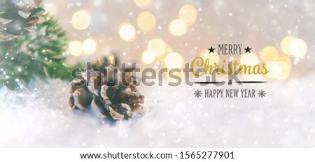 Merry Christmas and Happy New Year, Holidays greeting card with blurred bokeh background.