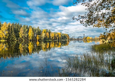 Beautiful autumn morning landscape of Kymijoki river waters. Finland, Kymenlaakso, Kouvola Royalty-Free Stock Photo #1565282284