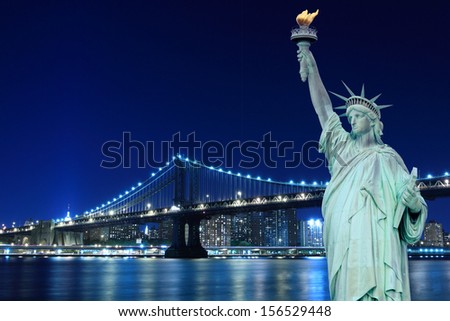 Manhattan Bridge and The Statue of Liberty at Night, New York City