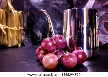 Fresh purple grapes with a classic background