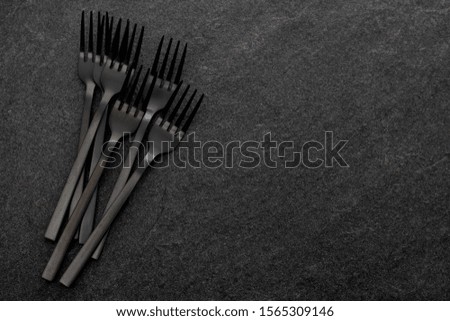 black forksd on gray ceramic background