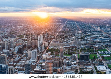 Business concept for real estate and corporate construction - panoramic urban city skyline aerial view under bright sky and beautiful sunset in Chicago, America